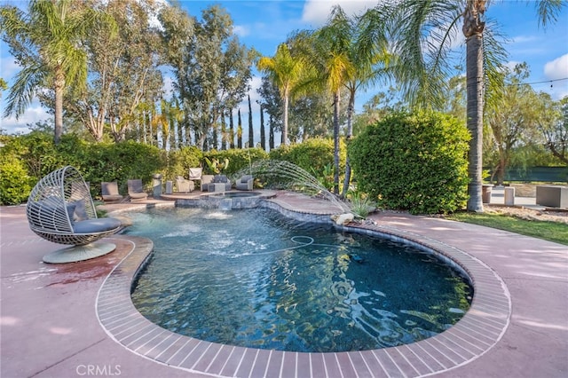 view of pool with a pool with connected hot tub and a patio