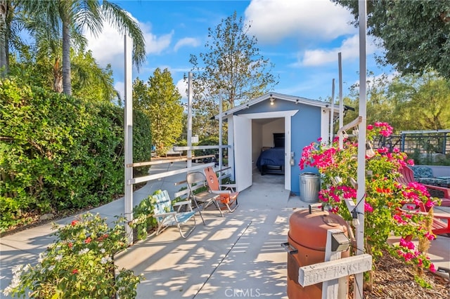 view of patio / terrace featuring an outbuilding