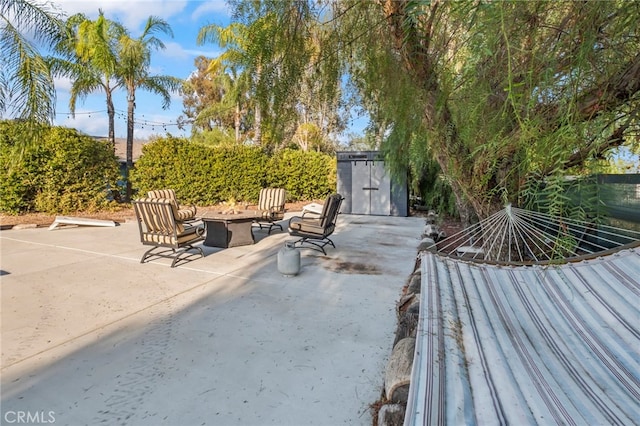 view of patio / terrace with an outdoor fire pit