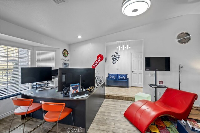 office area featuring recessed lighting, visible vents, and wood finished floors