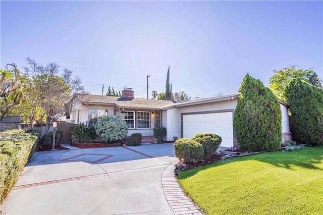 ranch-style home featuring a garage, concrete driveway, fence, a front lawn, and stucco siding