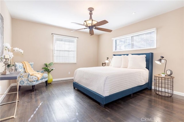 bedroom with a ceiling fan, baseboards, and wood finished floors