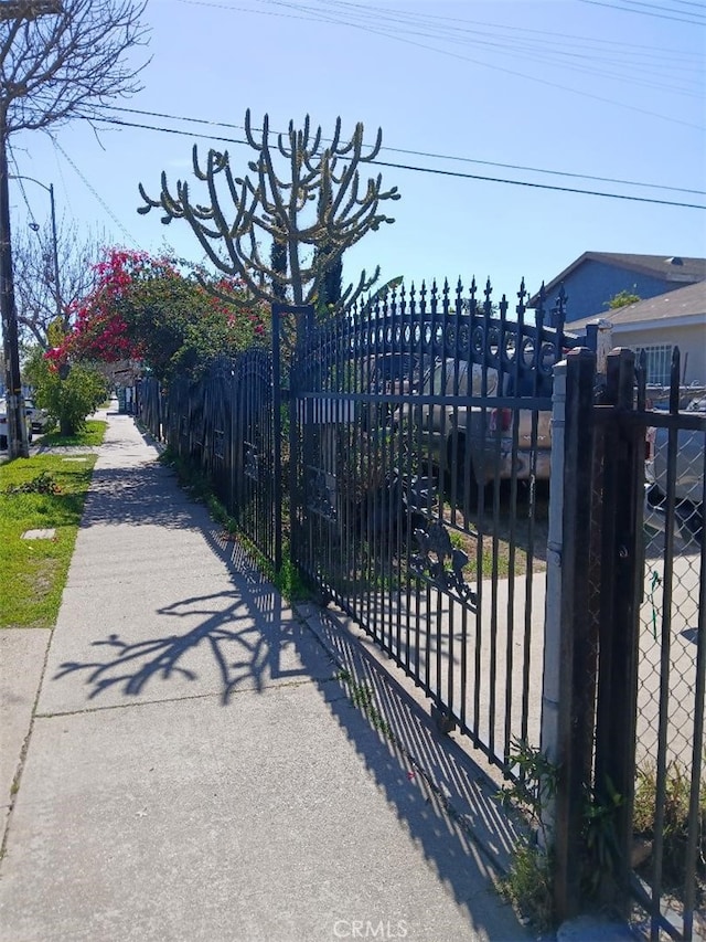 view of gate with fence