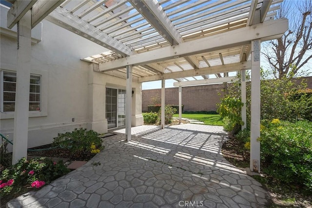 view of patio / terrace with fence and a pergola