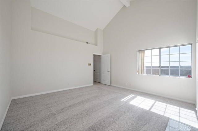 unfurnished room with light carpet, high vaulted ceiling, baseboards, and beam ceiling