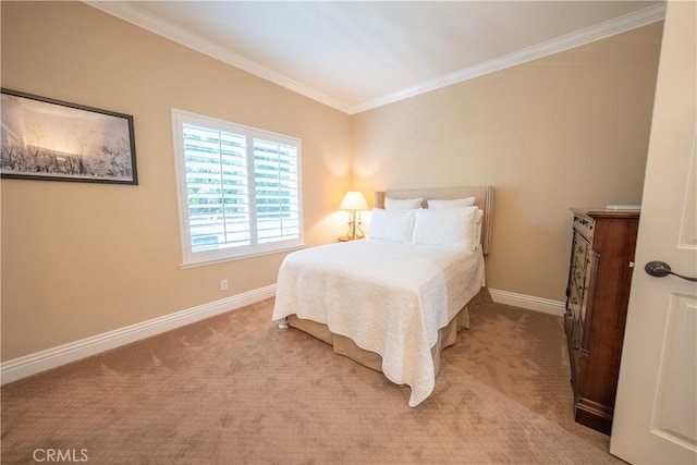 carpeted bedroom featuring crown molding and baseboards