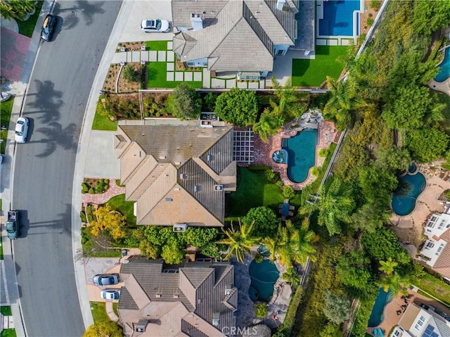 birds eye view of property with a residential view