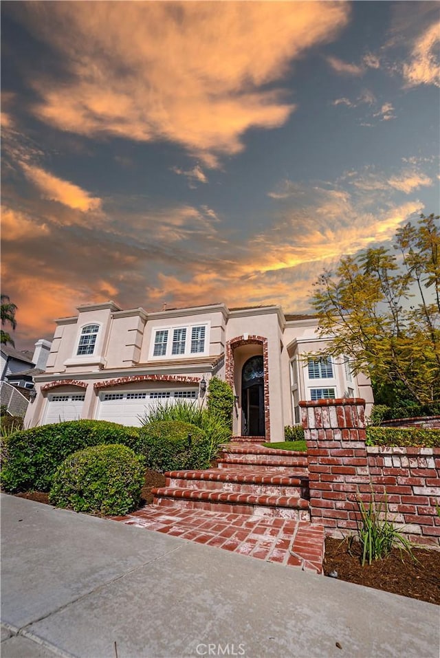 view of front of house featuring stucco siding