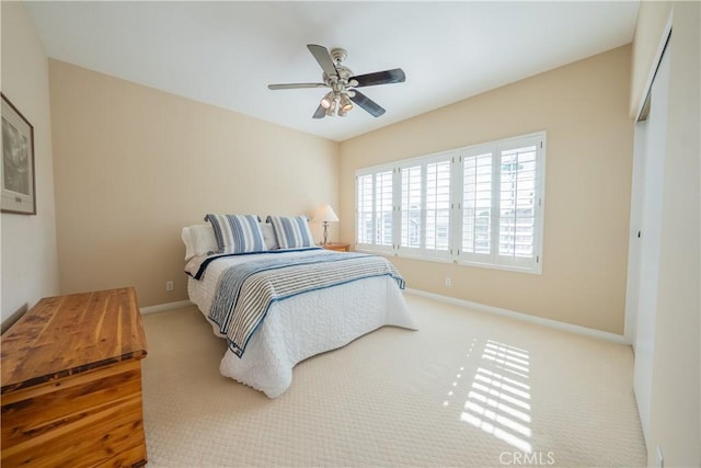 bedroom with baseboards and ceiling fan