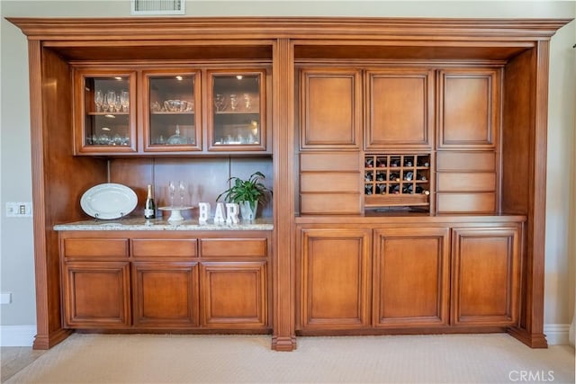 bar featuring visible vents and baseboards