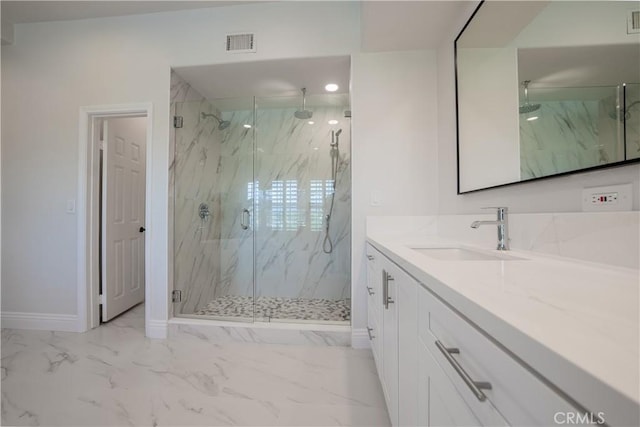 bathroom with vanity, baseboards, a marble finish shower, visible vents, and marble finish floor