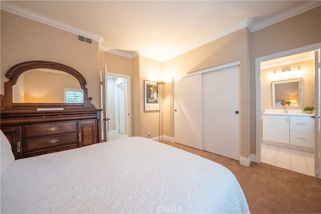 bedroom featuring a closet, light carpet, visible vents, and ornamental molding