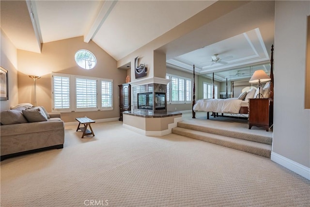 bedroom featuring beamed ceiling, high vaulted ceiling, carpet flooring, a fireplace, and baseboards