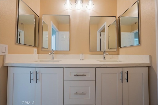 bathroom with double vanity and a sink