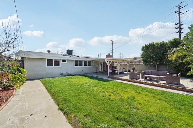 back of property featuring a lawn, a patio, cooling unit, an outdoor living space, and stucco siding