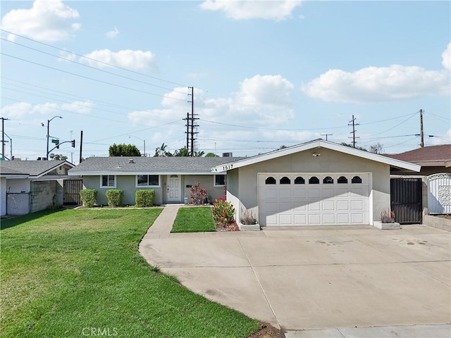 single story home with a garage, concrete driveway, fence, a front lawn, and stucco siding