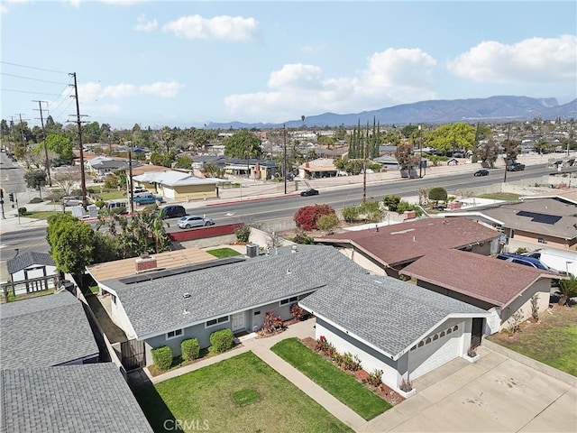 birds eye view of property with a residential view and a mountain view