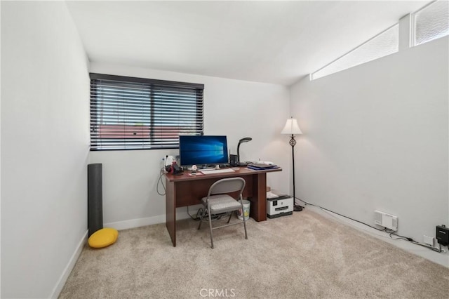 carpeted home office with baseboards