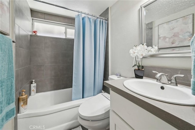 full bath with vanity, toilet, and shower / tub combo with curtain