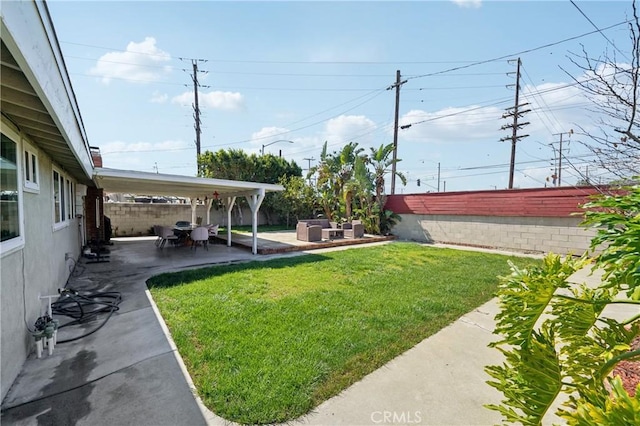 view of yard with a patio area and a fenced backyard