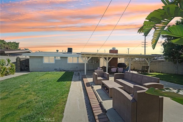 back of property with a lawn, an outdoor hangout area, a gate, a patio area, and fence