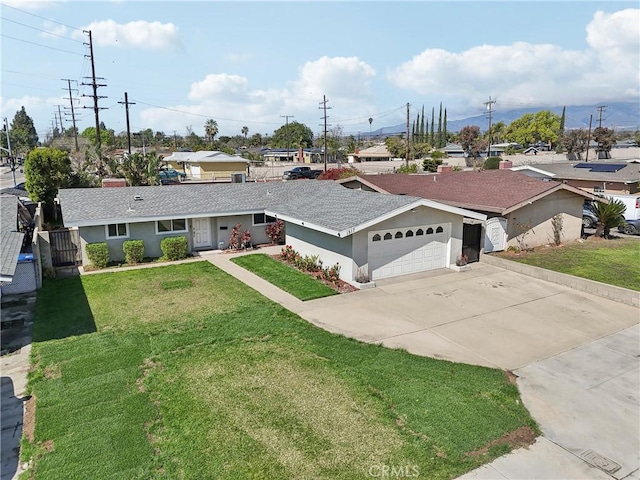 ranch-style home with a shingled roof, concrete driveway, an attached garage, a front lawn, and stucco siding