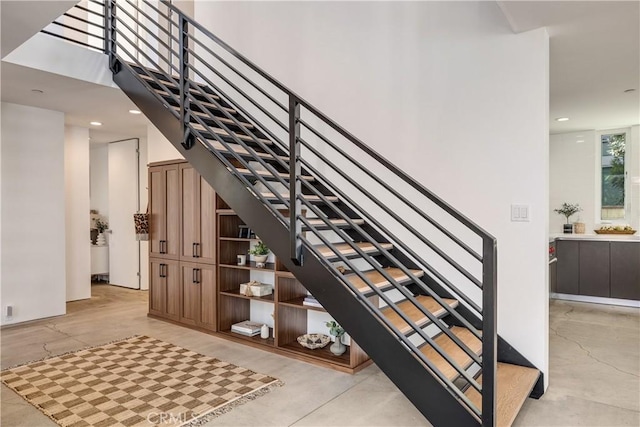 stairs featuring recessed lighting