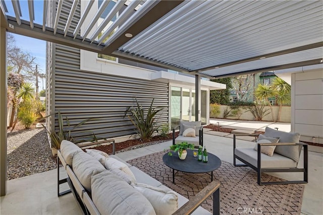 view of patio / terrace featuring fence and outdoor lounge area