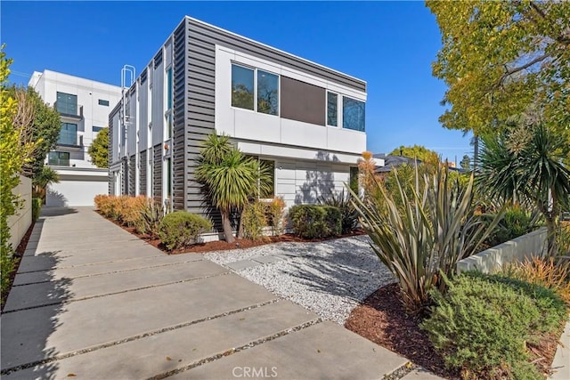 contemporary home featuring a garage and stucco siding