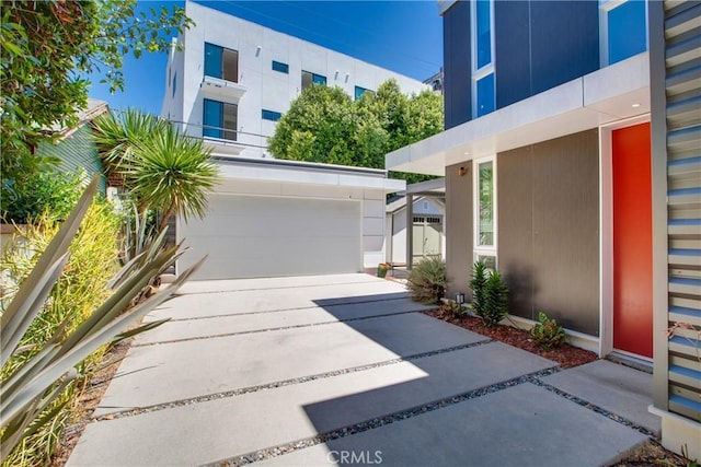 exterior space featuring a garage and driveway