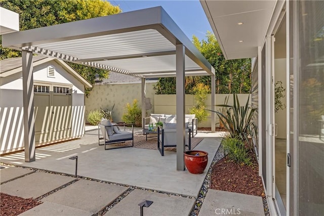 view of patio with a shed, an outdoor hangout area, a pergola, a fenced backyard, and an outdoor structure