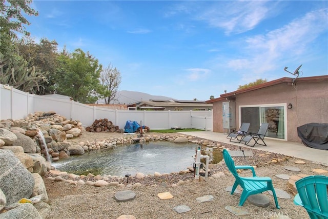 view of swimming pool with a patio area and a fenced backyard