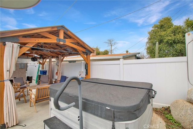 view of patio / terrace featuring fence and a gazebo