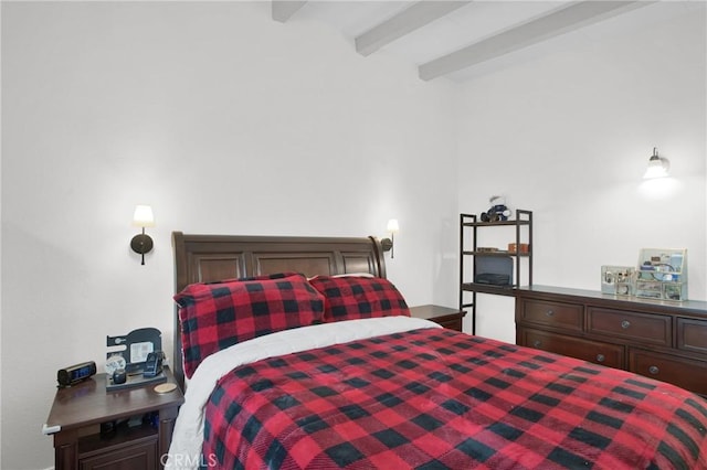 bedroom featuring beam ceiling