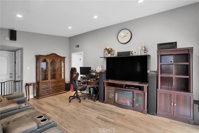 office with recessed lighting, visible vents, and wood finished floors