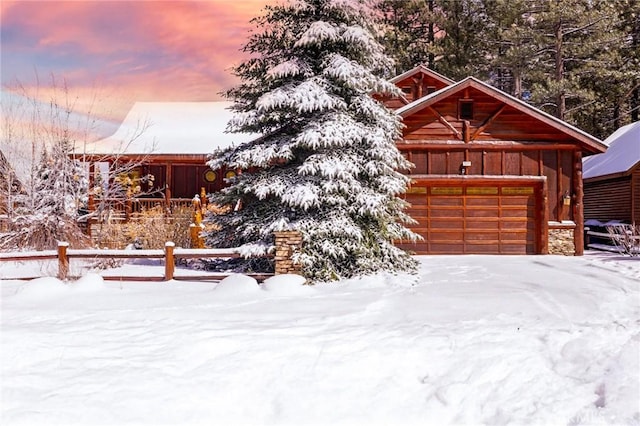 rustic home with a garage and board and batten siding