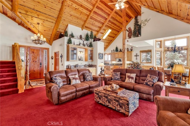 carpeted living room with beamed ceiling, stairway, and wood ceiling