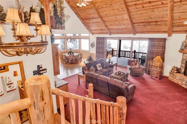 living area featuring wooden ceiling, a fireplace, beamed ceiling, and carpet flooring