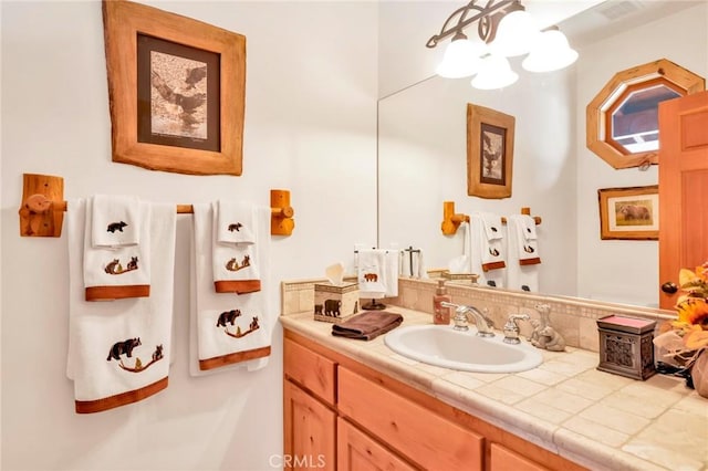 bathroom with visible vents and vanity