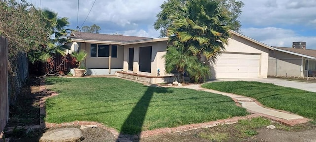 view of front of property with a front lawn, driveway, an attached garage, and stucco siding