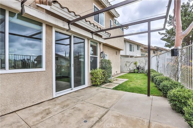 view of patio featuring fence