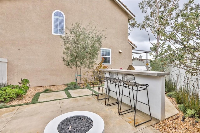 view of patio featuring outdoor wet bar