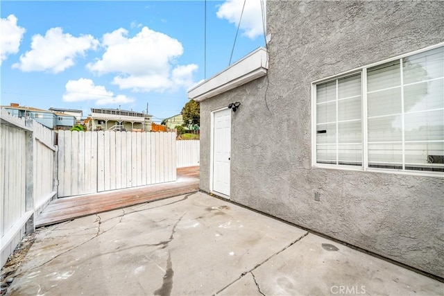 view of patio featuring fence