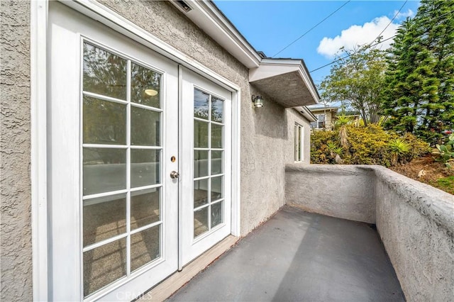 balcony featuring french doors