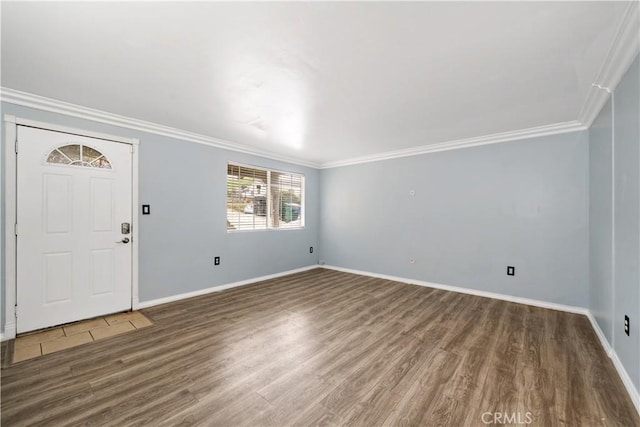 entryway featuring crown molding, baseboards, and wood finished floors