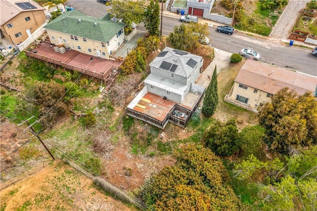 birds eye view of property with a residential view