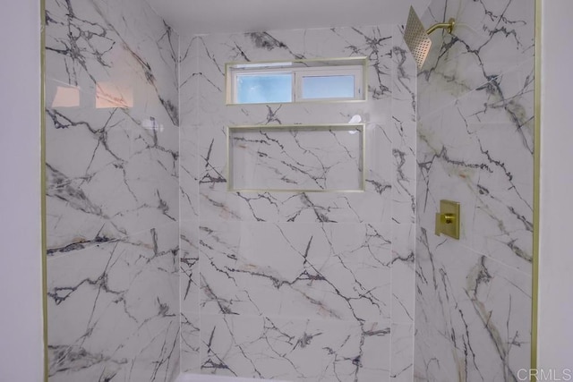 full bathroom featuring a marble finish shower