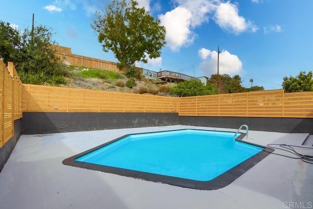 view of swimming pool with a patio, a fenced backyard, and a fenced in pool