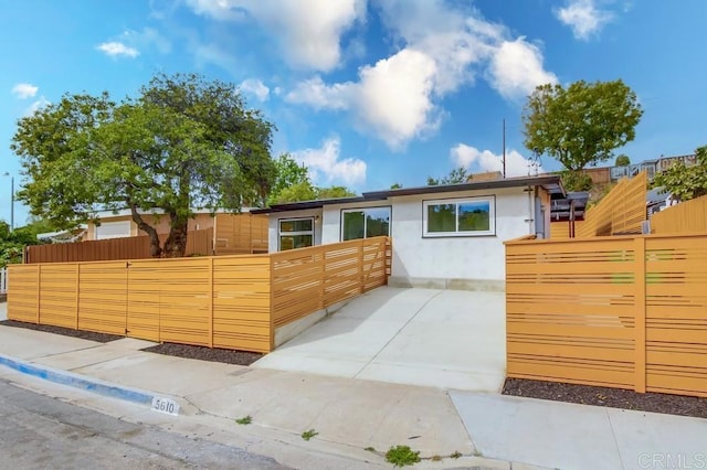 ranch-style house with fence