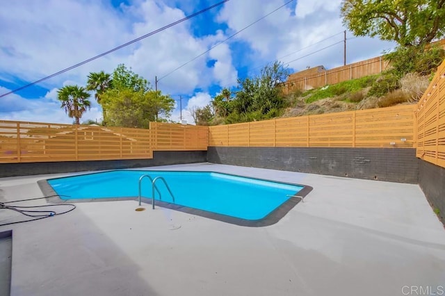 view of pool featuring a fenced in pool, a patio area, and a fenced backyard